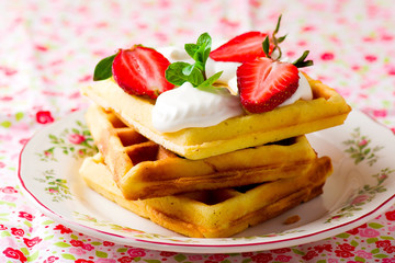 waffle with whipped cream and strawberry