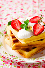 waffle with whipped cream and strawberry