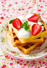 waffle with whipped cream and strawberry