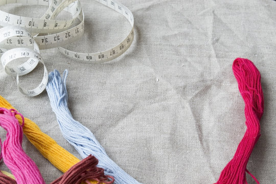 Accessories for embroidery on a gray canvas