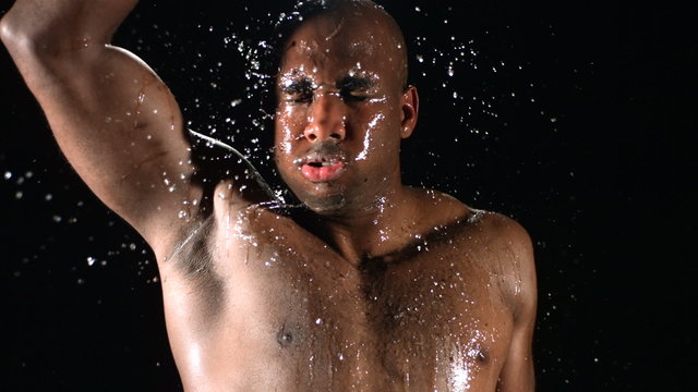 Athlete pouring water over head