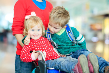 family with two kids travel in the airport