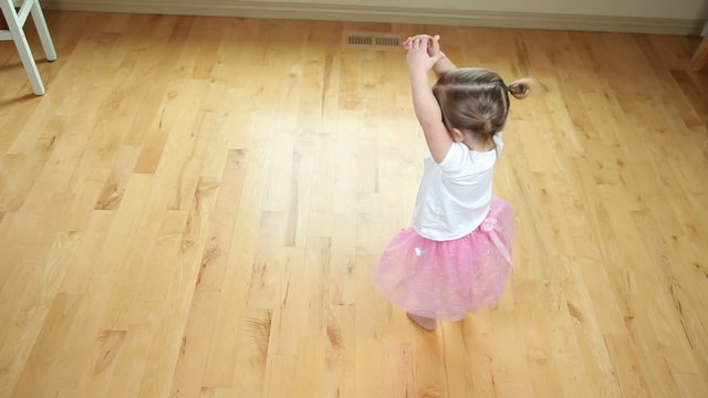 Young girl dancing like ballerina