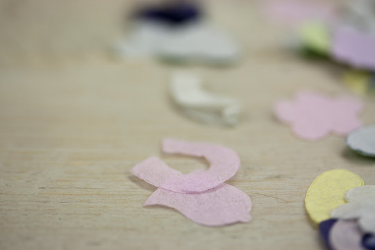 Confetti on a wooden background