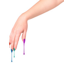 Female nails painted colored . Nail polish dripping on the nail