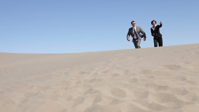 Businesspeople stranded in desert