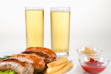 Roast beef or chicken sausage on a plate