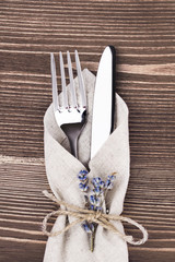 High Angle View of Silver Cutlery Set Wrapped in Linen Napkin
