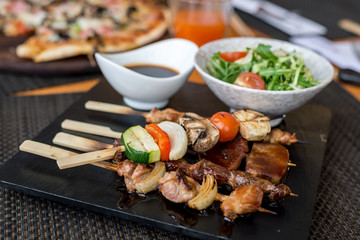 Assorted meat on skewers in  restaurant