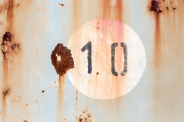  Number 10 on old painted and rusted metal panel