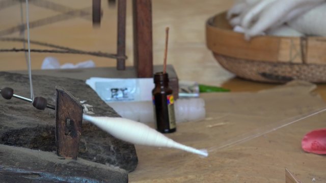 Hand-spinning fibers in the Korean Folk Village.