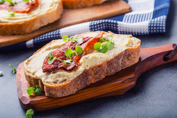 Spreads. Egg spread, grilled bacon, bread young basil leaves, Herb decoration. Ingredients: six eggs, spring onion, yeast, processed cheese, bacon, salt, pepper, various herbs decorations.