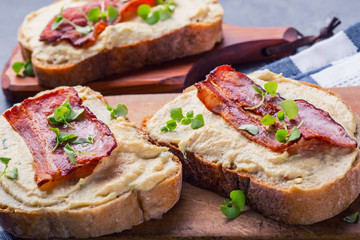 Spreads. Egg spread, grilled bacon, bread young basil leaves, Herb decoration. Ingredients: six eggs, spring onion, yeast, processed cheese, bacon, salt, pepper, various herbs decorations.