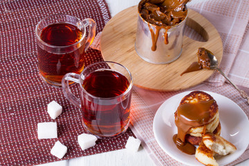 Cheesecakes with condensed milk and two cups of tea