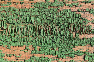 Fototapeta premium Old weathered cracked painted wall of an old village house