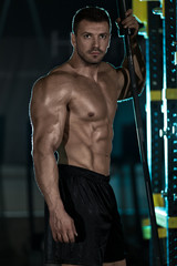 Fototapeta na wymiar Bodybuilder posing in the gym