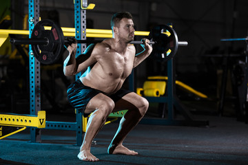 Fototapeta na wymiar Bodybuilder exercising with weights 