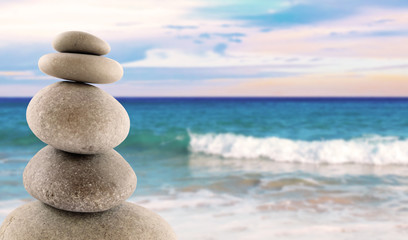 Balanced stones, sunny sea scene