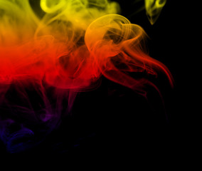 Obraz premium Colorful creative smoke waves on black - Colorful creative smoke waves on black background. Perfect for design, as graphic element or template background.