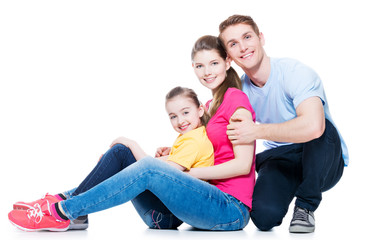 Happy young family with kid sitting.