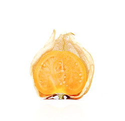 Physalis fruits cut half on white background.