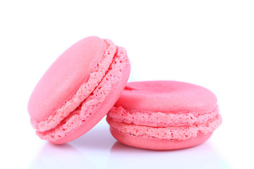 Two pink macaroons isolated on white