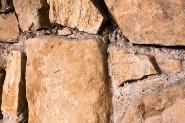 Large glossy stone wall. Diagonal view.