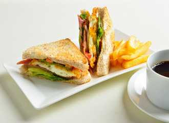 fresh and delicious classic club sandwich and cup of coffee and - 105176840