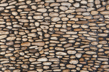 Cobbled pavement made of river rounded pebbles. Background textu