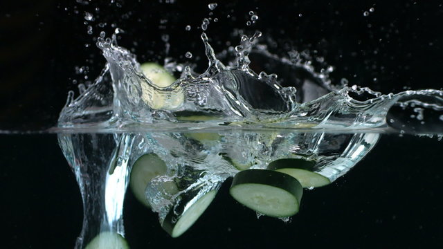 Cucumber splashing into water