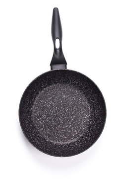 Top view of new empty frying pan isolated on white