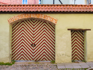 Old striped gate in the Old Town. Tallinn, Estonia