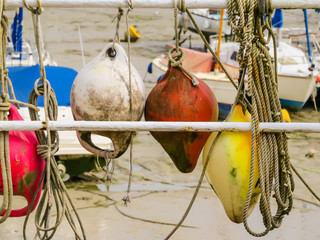 Colorful old buoys in Harbour Saint Aubin, Jersey island, Channel Islands