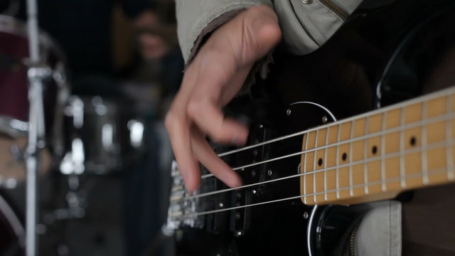 Closeup of man playing the bass