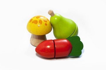 Wooden kids fruit and vegetable toys. Isolated on white background.