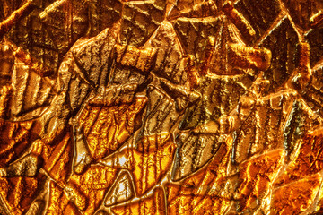 Fototapeta na wymiar molten glass golden color, background texture.