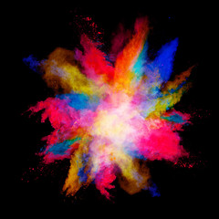 Explosion of colored powder on black background