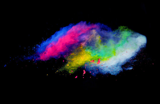 Explosion of colored powder on black background