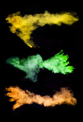 Fototapeta na wymiar Colored powder on black background