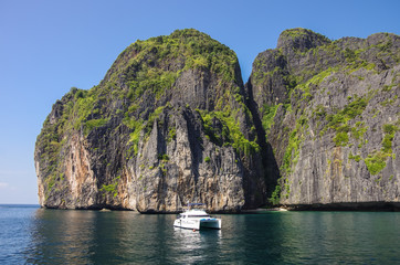 Yacht and beautiful limestone cliffs and clear sea of Phi Phi Leh south of Thailand, Krabi...