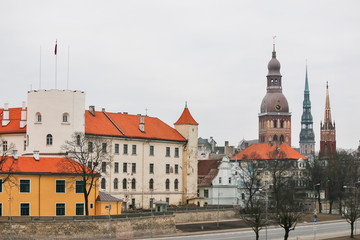 Naklejka na ściany i meble Riga Old Town panorama at dusk over Daugava river