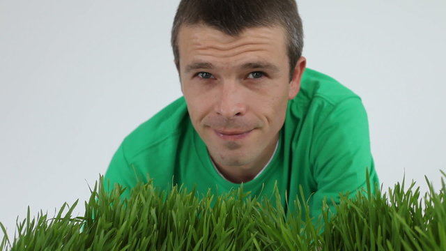 Man looking at grass