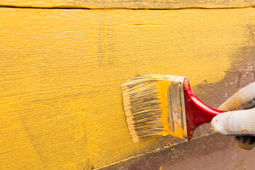 Painting fence yellow
