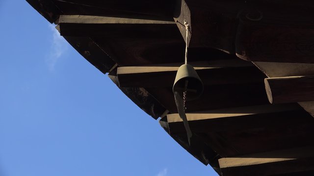 Traditional Hanok roof with a wind chimes in the Minsok Folk Village. Seoul
