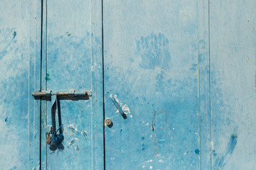 blue door with lock and hand print in Merzouga