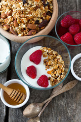 healthy snack - granola on wooden surface
