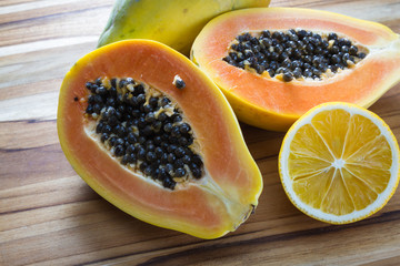 Papaya cut in half served with lemon