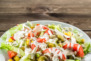 Colorful vegetable salad with tomato and lettuce.