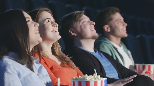 Four friends in a multiplex view perspective
