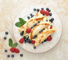 pancakes with cottage cheese and berries. top view